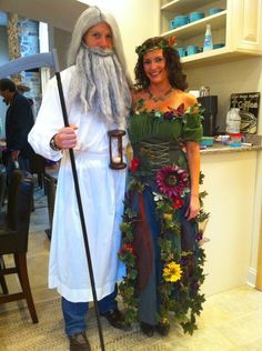 two people dressed in costumes standing next to each other