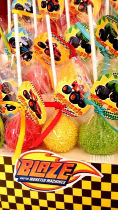 an assortment of monster trucks lollipops on display