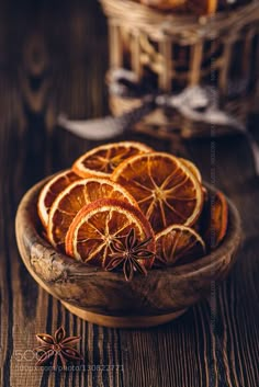 orange slices and star anise in a wooden bowl