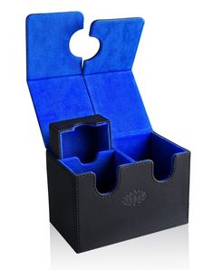 an open black and blue box with two compartments on the inside that has a circular hole in it