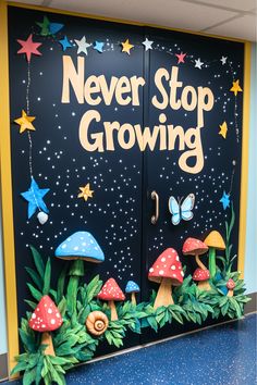 the door to never stop growing is decorated with mushrooms and stars