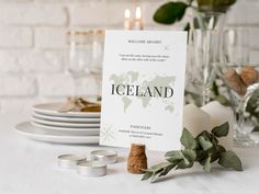 a place setting with candles, plates and napkins on the table for an event