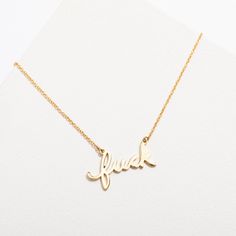 Wear a fuck necklace and give absolutely zero fucks at the same time. DETAILS- 14k gold or sterling silver plated brass pendant- 14k gold filled or sterling silver chain- Nickel-free and naturally hypoallergenic- Pendant measures 1" by .5"- Chain measures 16" in length + 3" extender Blondie Heart Of Glass, Blondie Band, Oversized Band Tee, Script Necklace, Rock Gifts, Necklace Stack, Brass Pendant, Gold Filled Chain, Gold Plated Sterling Silver