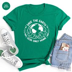 Eco-friendly Green Cotton T-shirt, Green Crew Neck Tops For Earth Day, Earth Day Graphic Tee With Crew Neck, Eco-friendly Short Sleeve T-shirt, Eco-friendly Green Crew Neck T-shirt, Eco-friendly Cotton T-shirt For Earth Day, Green Eco-friendly Crew Neck T-shirt, Eco-friendly Graphic Print Top For Earth Day, Earth Day Screen Print Short Sleeve Tops