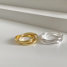 Unveil the beauty of interconnectedness with our Minimalist Sterling Silver Rolling Fidget Ring, a piece that marries minimalist design with the allure of modern sophistication. These statement rings are meticulously crafted from 925 sterling silver, available in two stunning finishes - a radiant 18k gold plating and a sleek silver. The design features three interlocking bands that roll freely over each other, creating a dynamic silhouette that encircles your finger. It's not only a simple ring; Gold Stackable Rings, Interlocking Ring, Gold Rings Stackable, Fidget Rings, Simple Ring, Ring Minimalist, Minimalist Rings, Rings Simple, Rings For Women