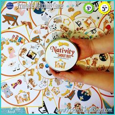 a person holding a small tin with stickers on it's side and the words nativity about you in front of them