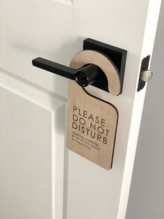 a door handle with a sign that says please do not disturb