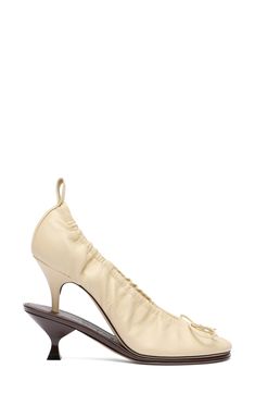 Double the drama with this ballerina-inspired, bow-trimmed lambskin-leather pump that's crafted in a playfully stacked silhouette. 4" (102mm) heel Leather upper, lining and sole Made in Italy Designer Shoes Evening Cream Calf Leather Heels, Cream Calf Leather Heels For Evening, The Drama, Pale Yellow, Leather Pumps, Lambskin Leather, Women's Pumps, Designer Shoes, Dark Brown