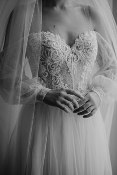 a woman wearing a wedding dress and veil