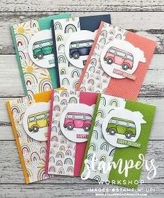 six different colored cards with the words happy campers on them, and one has a bus