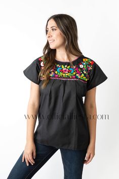 Mexican Embroidered Pueblo Blouse - Black  These fabulous blouses feature a unique colorful embroidered pattern. These embroidered blouses are also commonly known as Mexican Peasant Blouse Tops.  Please note that each blouse is individually hand embroidered so the embroidery design will vary from the one pictured. You will receive the blouse color selected. Black Embroidered Peasant Top, Black Peasant Blouse With Floral Embroidery, Black Cotton Blouse With Geometric Embroidery, Peasant Style Embroidered Black Blouse, Black Embroidered Peasant Blouse, Black Peasant Top With Floral Embroidery For Festivals, Black Embroidered Peasant Top For Festivals, Black Floral Embroidered Peasant Top For Festival, Black Folk Style Peasant Top