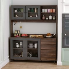 a kitchen with an oven, microwave and shelves filled with food on top of it