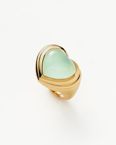 Jelly Heart Gemstone Ring | 18ct Gold Plated/Aqua Chalcedony blue/gold. Share the Love. The Chubby Jelly Heart Gemstone Ring is Set with a Dyed Aqua Chalcedony Cabochon Stone – Known for Bringing Harmony – Surrounded by Signature Ridge Detailing on a Domed Band. Wear Solo or Stack with Other Chunky Pieces. This Piece Contains a Semi-Precious Gemstone that is Natural, Meaning Each Stone is Completely Unique. There May be Variations in the Patterns, Colour Hues and Size Because of This. Metal: 18Ct Recycled Gold Plated on Brass Gemstone: Aqua Chalcedony Dimensions: 20mm X 17mm Stone Height: 7mm Weight: 9. 5g Product Code: Msg-G-R1-Aqc Please Note: Our Gemstones are Naturally Sourced and May Vary in Colour. Jelly Hearts, Purple Quartz, Leaf Bracelet, Aqua Chalcedony, Statement Ring Silver, Heart Gemstone, Blue Quartz, Pink Quartz, Recycled Gold