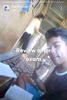 a man sitting in front of a computer keyboard with the words review after exam written on it