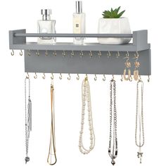 a shelf that has some jewelry hanging on it