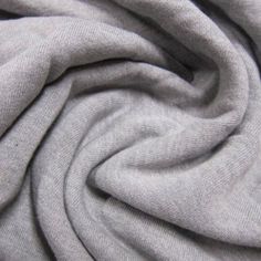 a close up view of a grey fabric