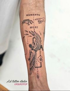 a man with a tattoo on his arm that reads, mementoo mori