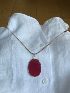 "Vintage 1970 hand made Carnelian gemstone Art Deco oval pendant in garnet color with sterling silver Necklace. Very elegant and stylish classic jewelry gift for women for every occasion. Collectible handmade ladies' pendant with elegant silver necklace. An accent that would make every woman look stunning. The clasp on the back side of the chain is working properly. Amazing present for vintage watch lovers. The necklace and the pendant are in very good condition. The necklace is of silver of Italian origin. Pre-owned. There are minor wear signs but otherwise the necklace is in a very good condition. Very fine looking jewerly with no visible defects. Perfect for festive occasions for the loved one. Exceptional gift for ladies.  SIZE: Width: 30 mm  (1.18\") Pendant height: 43 mm (1.69\") Thi Oval Ruby Necklace In Silver, Handmade Oval Ruby Necklace, Red Oval Pendant Necklace With Polished Finish, Garnet Color, Necklace Art Deco, Oval Pendant Necklace, Gemstone Art, Necklace Art, Art Deco Pendant