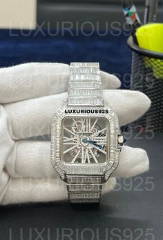 VVS Moissanite Diamond Watch | Iced Out Moissanite Studded Automatic Watch | Bling Bling Icy | Hiphop Watch Baguette Cut Diamond All the moissanite we sell can pass the diamond test. You can shine like a diamond without paying as much as a diamond. You can contact us to cover your watch with moissanite. The clock in the picture is an example. We can cover the watch you want with moissanite. - Free Express Shipping Material : Stainless Steel Clasp Style : Buckle Moissanite Clarity: VS /VVS Moveme Luxury Round Diamond Watch For Weddings, Diamond Watch With Diamond Accents As A Gift, Silver Watches With Rectangular Dial For Wedding, Silver Diamond Watch With Brilliant Cut As Gift, Silver Rectangular Dial Watches For Wedding, Luxury Cubic Zirconia Jewelry And Watches For Anniversary, Diamond Wedding Watch With Diamond Hour Markers, Luxury Cubic Zirconia Watch For Anniversary, Wedding Diamond Watch With Diamond Hour Markers