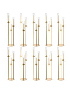 six brass and clear glass candlesticks in the shape of columns, set of eight