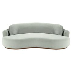 an oval shaped couch with grey fabric