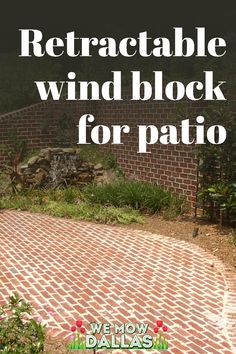 a red brick patio with the words retractable wind block for patio on it