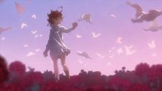 a girl standing in the middle of a field with birds flying around her