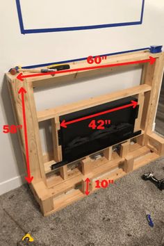 an entertainment center made out of pallet wood with measurements for the top and bottom