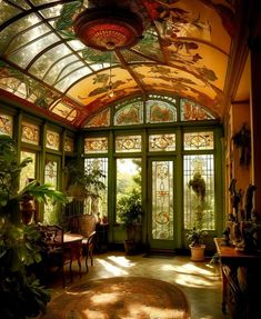 the sun shines through an ornately decorated room with green walls and glass doors