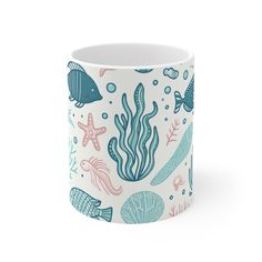 a coffee cup with sea life on it