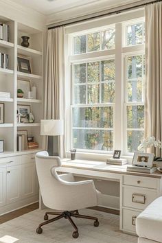 a white desk and chair in front of a large window with bookshelves on both sides