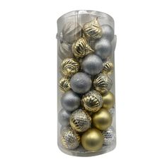 a clear container filled with silver and gold christmas bauble ornament balls