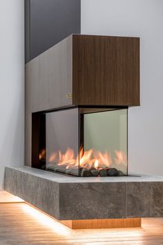 a modern fireplace in the middle of a room