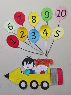 a yellow school bus with balloons and numbers on it