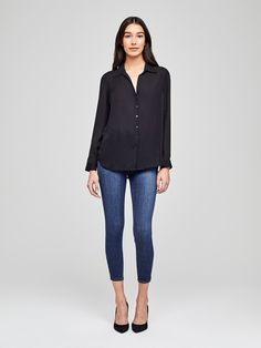 A modern classic. The Nina blouse is structured in all the right places with a relaxed, flattering fit. Refined button-down construction with a chic open collar and draped long sleeve in black silk. Sleek Spring Blouse With Button Closure, Versatile Black Blouse For Business Casual, Sleek Collared Blouse For Business Casual, Sleek Collared Blouse For Workwear, Modern Business Casual Blouse For Fall, Silk Blouse With Shirttail Hem For Work, Sleek Collared Blouse For Fall, Sleek Spring Shirt, Modern Button-up Fall Blouse