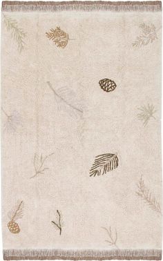 a white rug with leaves and pine cones on it