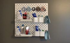 a bathroom wall shelf filled with personal care items