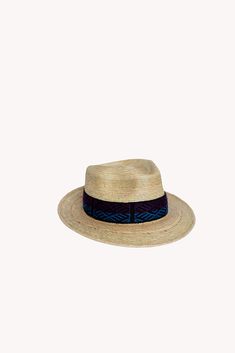 Handcrafted in Guatemala, these Palm Leaf Straw Hats are durable and offer full sun-protection for your everyday activities. Modeled after our best-selling Fedora Alpaca Wool Hat, the unisex Fedora Palm Leaf Hat is a traditional “Fedora Style” hat with a removable Quechua textile intention band. You choose your own intention band. Available in sizes S, M, L & XL for men and women. 100% Guatemalan Palm Leaf 9.5cm x 7.5cm brim length You choose your own woven band Handmade in Guatemala Summer Blue Straw Travel Hat, Summer Travel Blue Straw Hat, Natural Color Fedora Hat For Outdoor, Natural Fedora Hat For Outdoor, Natural Panama Hat With Short Brim For Outdoor, Blue Wide Brim Straw Hat For Travel, Natural Short Brim Panama Hat For Outdoor, Outdoor Fedora Sun Hat In Toquilla Straw, Toquilla Straw Fedora Sun Hat For Outdoor