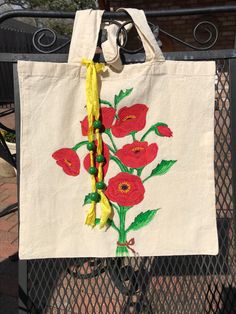 This canvas tote is perfect for carrying your laptop or anything else.  It is 13" x 15", made of 100% cotton.  It has been washed, pre-shrunk, and ironed before I painted it with fabric paint.  I added a silk ribbon with wood beads for some fun!  The silk ribbon can be easily removed when you wash the bag. Painted Poppies, Personal Project, Fabric Paint, Silk Ribbon, Canvas Tote Bag, Houston Tx, Wood Beads, Some Fun, Canvas Tote