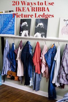 clothes hanging on a rail in a bedroom