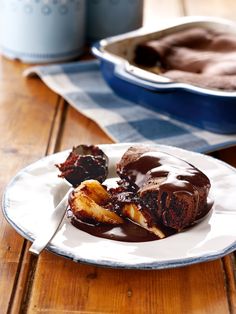 a white plate topped with chocolate covered donuts