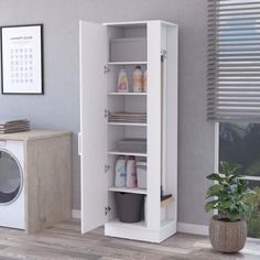 a laundry room with a washer and dryer next to the wall in front of it