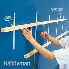 a man is measuring the length of a wall