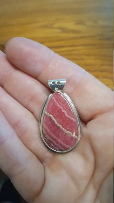 Beautiful quality Rhodochrosite pendant with silver bezel and bail. 1.5 inches long. May 23, Druzy Ring, Houston Tx, Beautiful Things, Pendant Necklaces, Jewelry Necklace Pendant, Houston, Etsy Accessories, Gemstone Rings