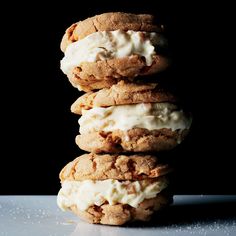 three cookies stacked on top of each other with ice cream in between the two ones