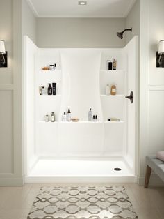 a bath room with a toilet and a shelf filled with bottles on the wall next to a rug