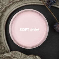 soft pink powder in a silver bowl on a table with dried flowers and an ornate frame