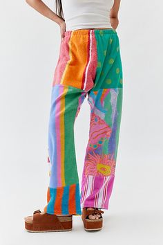 Remade Pieced Towel Pants from Urban Renewal cut in a mid-rise with a straight leg. Features an allover vibrant design made from beach towels. This modern design was created by Urban Renewal from unique vintage and deadstock items found around the world. Though similar in style to what you see here, each upcycled item is one-of-a-kind and may vary from piece to piece. Features Remade Pieced Towel Pants from Urban Renewal Made from pieced beach towels for a vibrant look Elasticated waistband Urban Renewal Remade features upcycled pieces reimagined by our Urban Renewal team Updated by hand in the US, so no two are exactly alike You will receive a completely unique piece that will vary from the item pictured here Content + Care Vintage fabrics vary Machine wash Made in the USA Size + Fit Mode Summer Vibes Clothes, Ocean Pacific Clothing, Towel Clothing, Labor Day Outfits, Towel Pants, Spa Outfit, Towel Clothes, Urban Outfitters Clothes, Fun Clothes