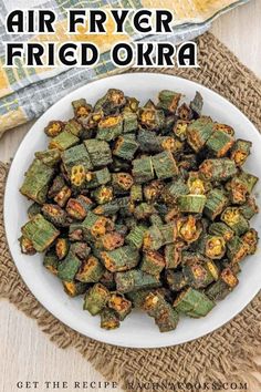 air fryer fried okra in a white bowl on top of a burl