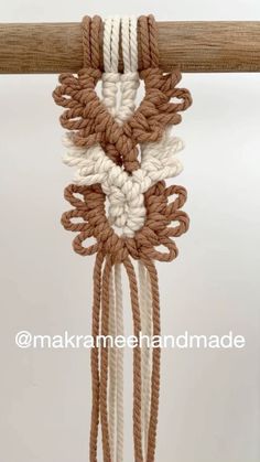 a close up of a piece of rope hanging from a pole